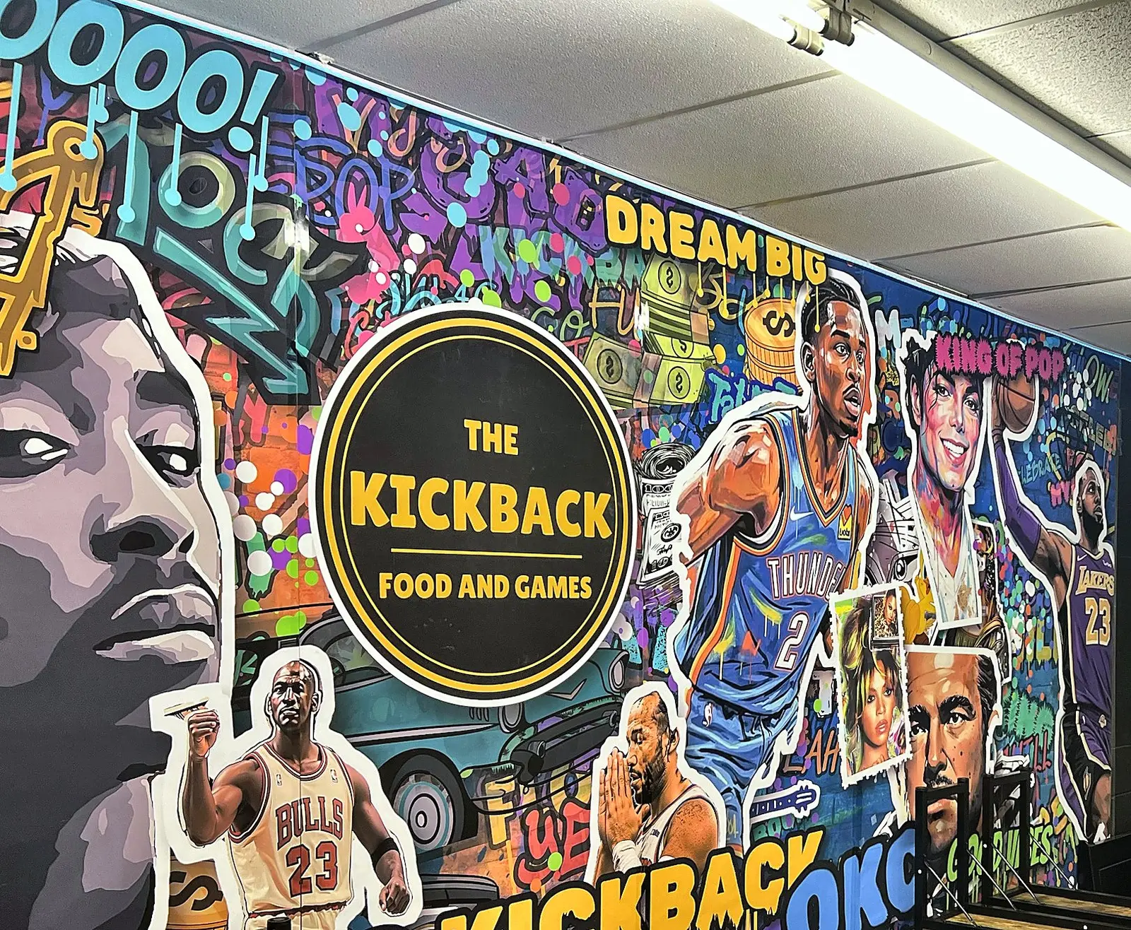 Party room mural with the Kickback logo