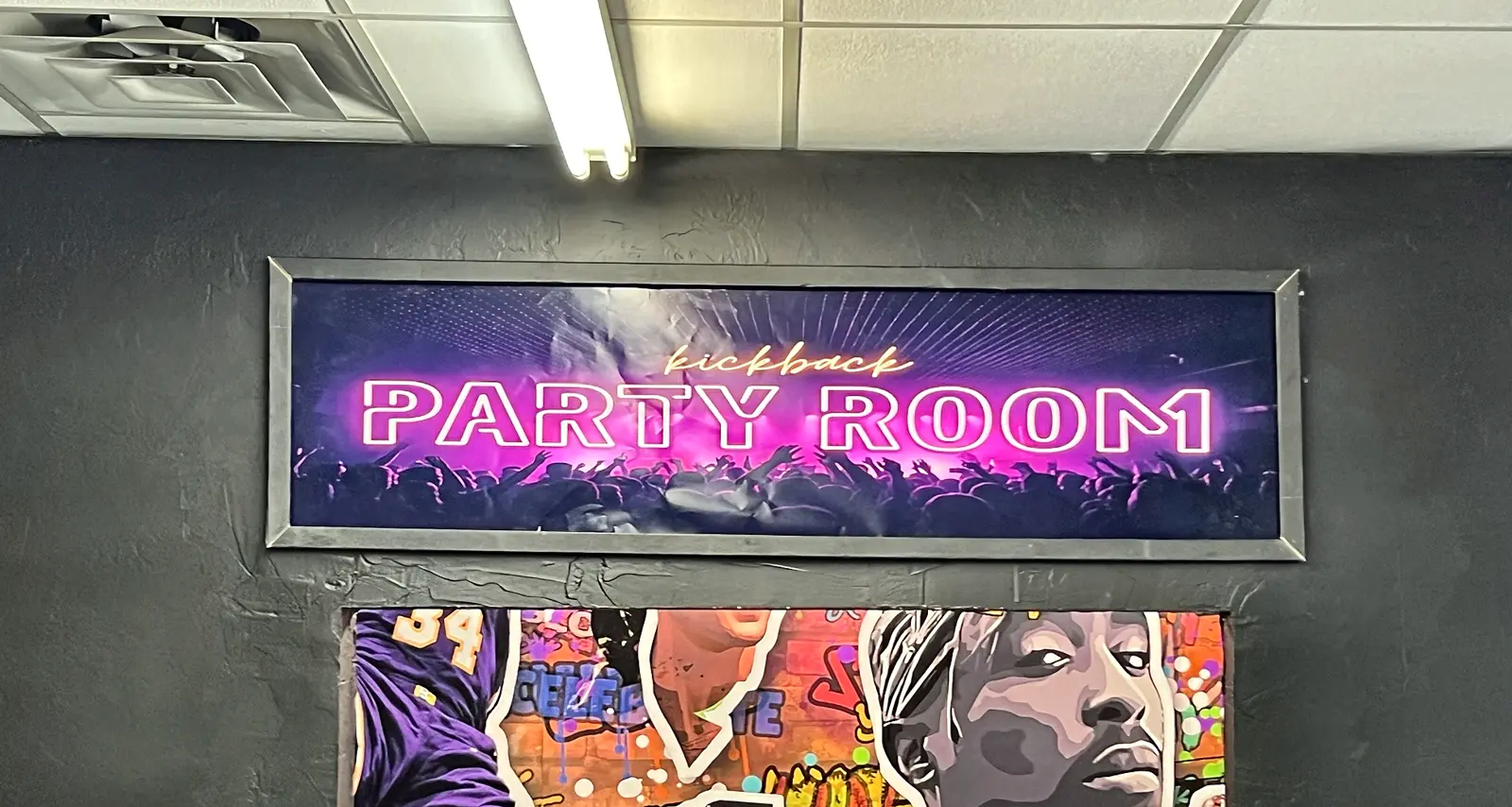 Kickback Party Room sign over the mural entrance